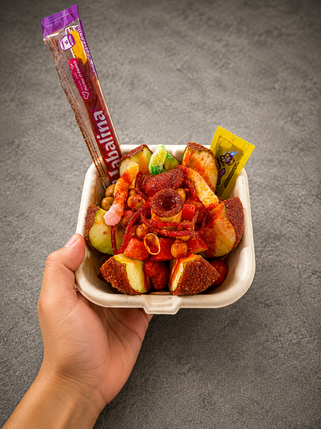 Coctel de frutas with Tajín, jabalina, and chamoy
